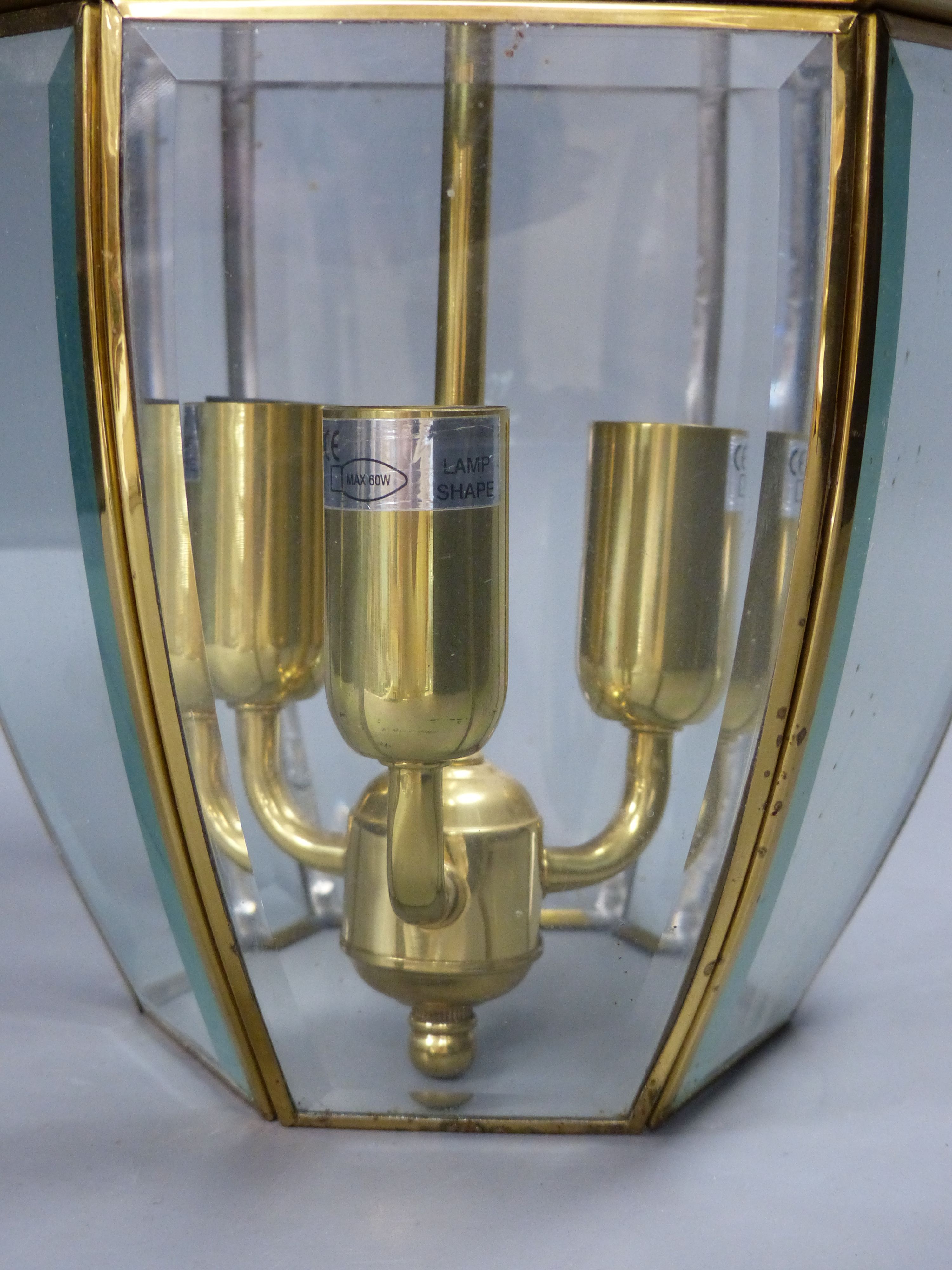 A hexagonal gilt metal and glass hall lantern